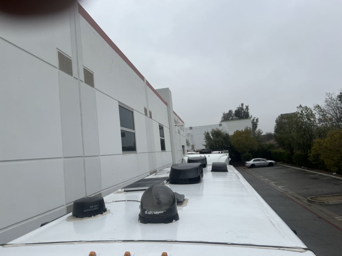 RV roof before repair, vents and satellite dish